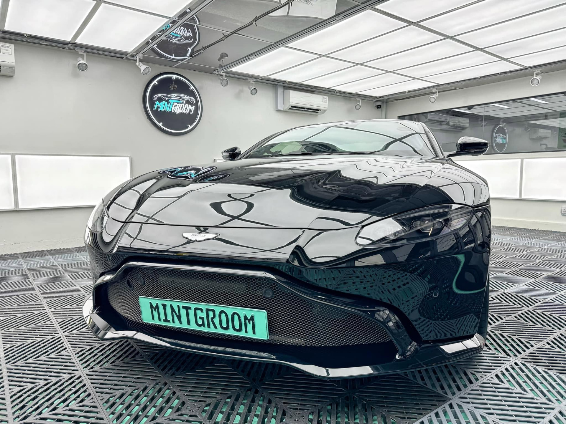 Black Aston Martin Vantage freshly detailed in the MintGroom studio