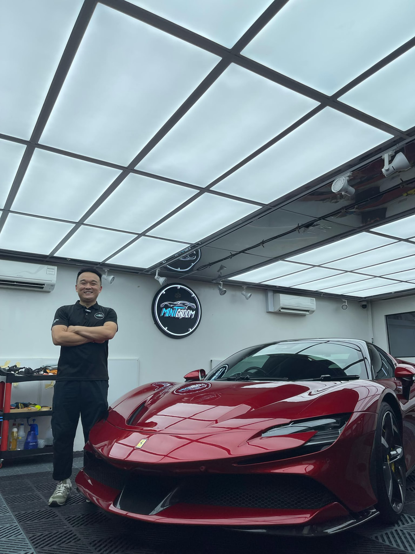 Calvin, founder of MintGroom, with a MintGroom car in the studio